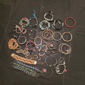 BAG OF BRACELETS MULTI BRANDS AND STYLES 2 LBS ALL WEARABLE